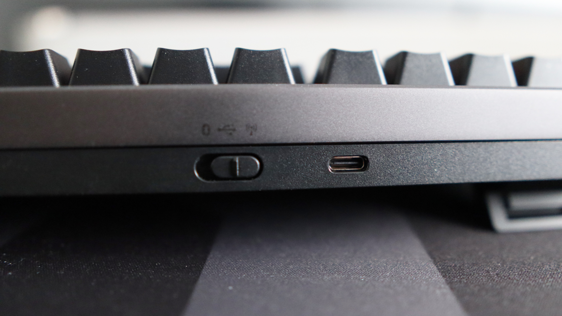 Asus ROG Strix Morph 96 Wireless on a desk mat.