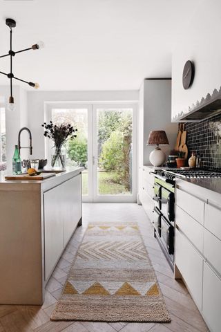 A striped kitchen runner in a modern cozy kitchen
