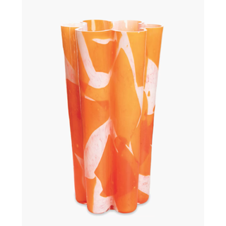 tall glass vase with orange abstract print and curved floral-esque edges