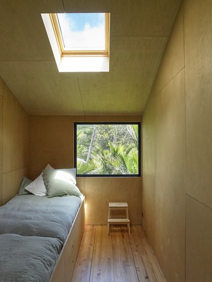 Inside a surfer's modern and minimalist beach-front cabin in New Zealand