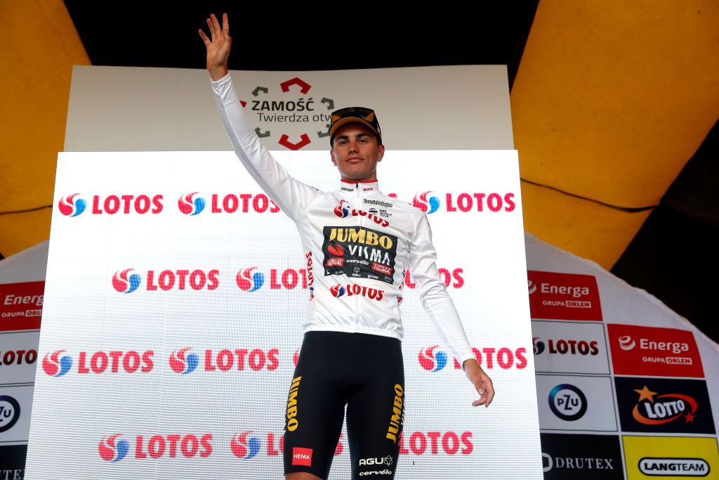 ZAMOSC POLAND JULY 31 Olav Kooij of Netherlands and Team Jumbo Visma celebrates winning the white best young jersey on the podium ceremony after the 79th Tour de Pologne 2022 Stage 2 a 2056km stage from Chem to Zamo TdP22 WorldTour on July 31 2022 in Zamosc Poland Photo by Bas CzerwinskiGetty Images