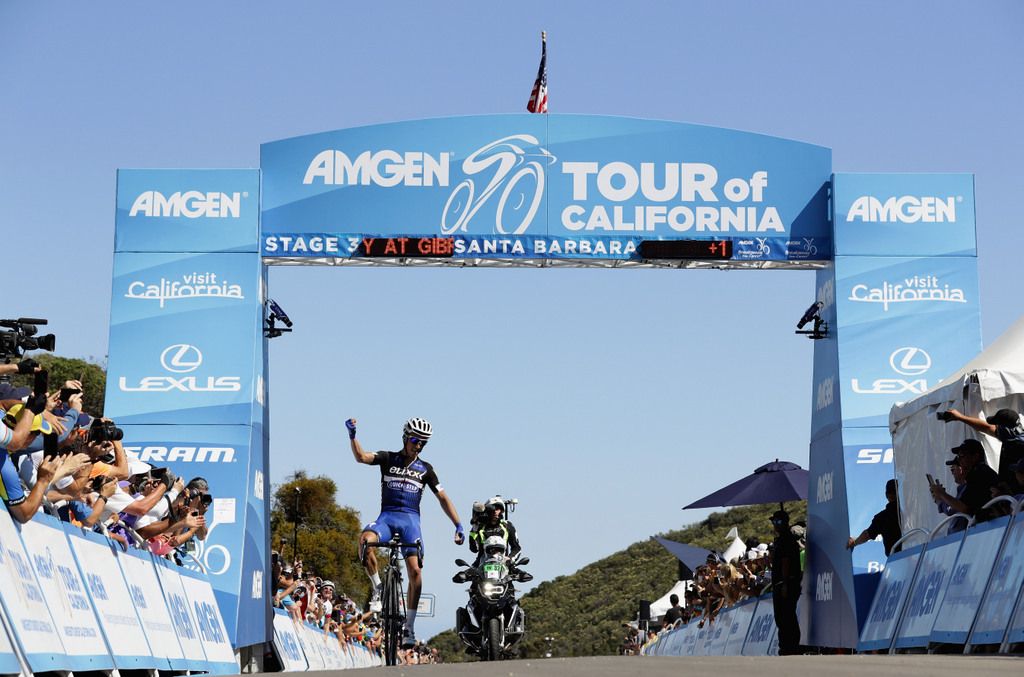 Julian Alaphilippe (Etixx - Quick-Step) celebrating as he crosses the line