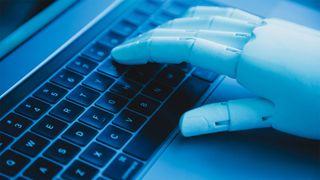 Robot hand on keyboard