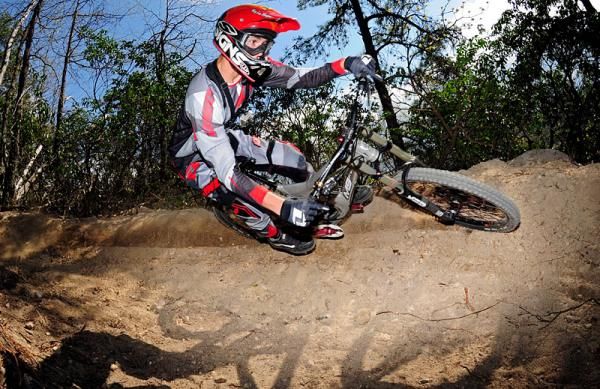Sam Skidmore tests out the newly rebuilt part of the downhill course at Massanutten