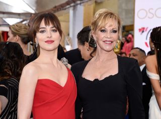 Actresses Dakota Johnson (L) and Melanie Griffith attend the 87th Annual Academy Awards at Hollywood & Highland Center on February 22, 2015.