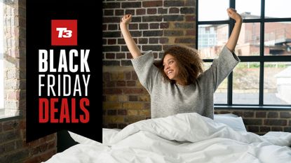 Woman stretching in bed, with a Black Friday mattress deals flag overlaid