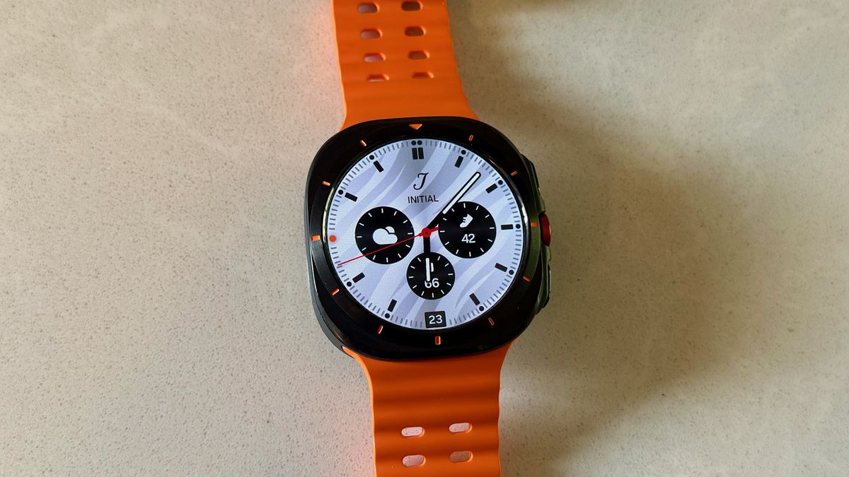 The Samsung Galaxy Watch Ultra sitting on a white counter, showing the Premium Analog watch face.