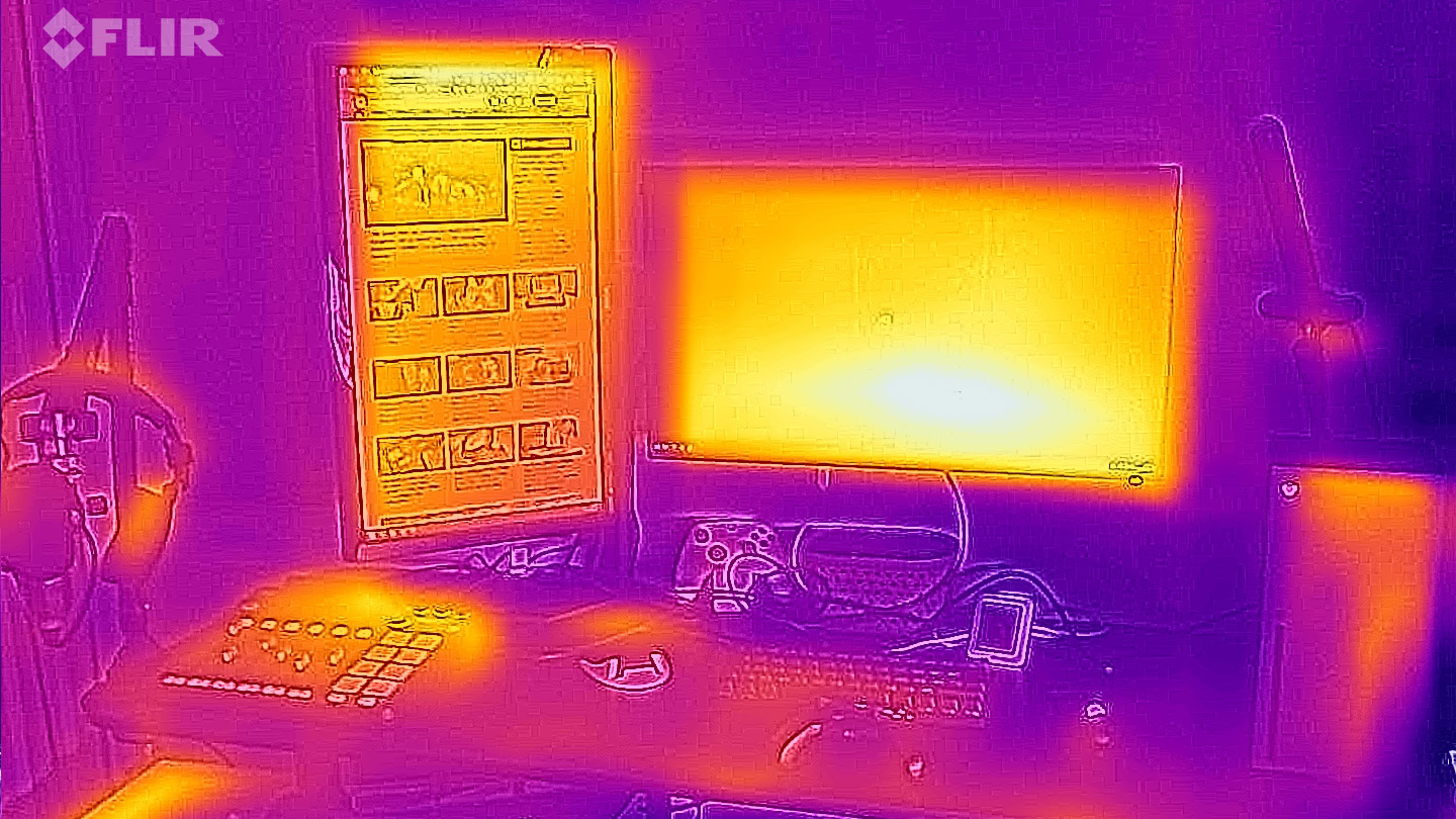 Desk with dual monitors and Xbox Series X viewed through a FLIR thermal camera