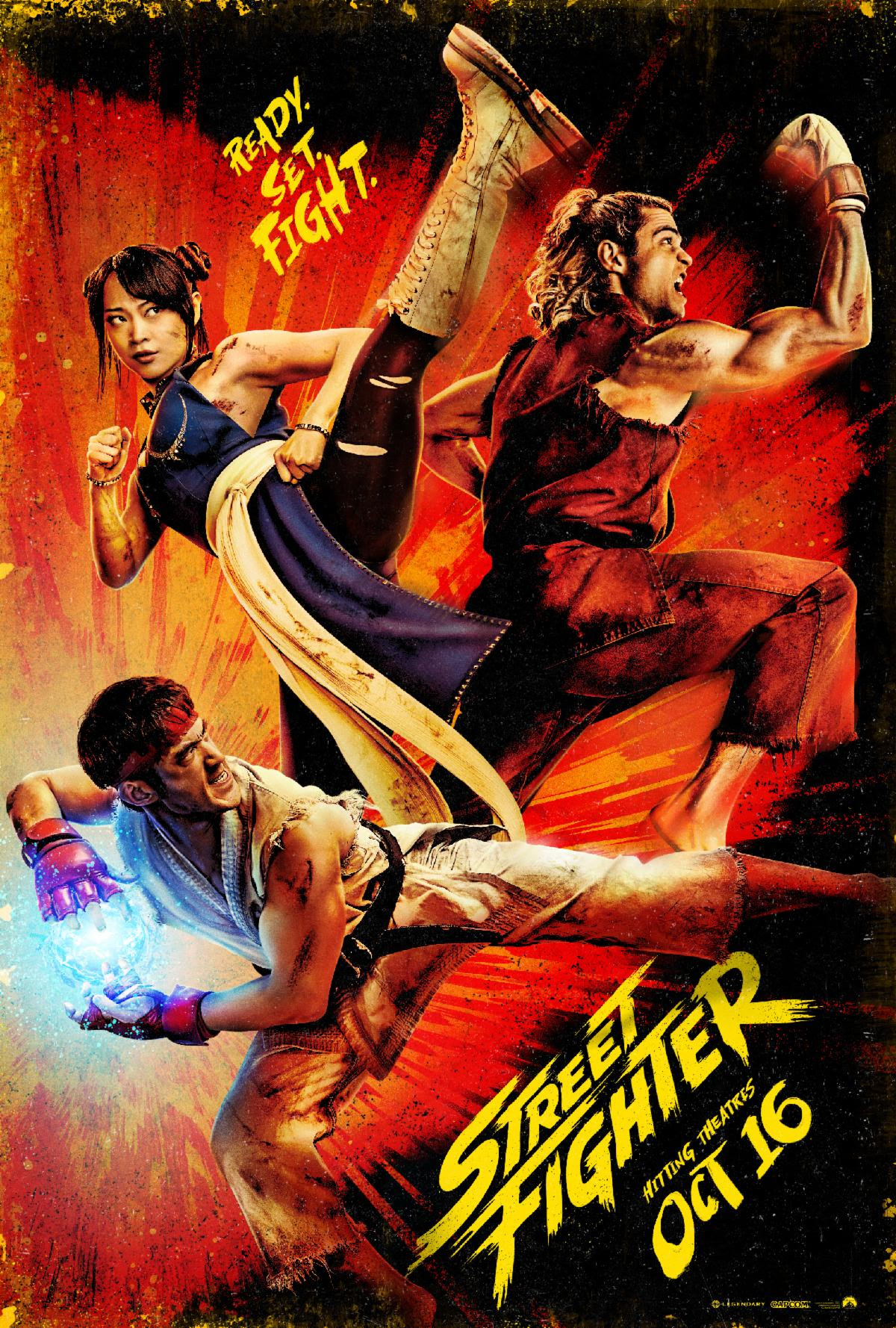 the poster of the 2026 action movie street fighter featuring two men and one woman in japanese inspired uniforms kicking and punching