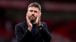 Manchester United manager Michael Carrick applauds the fans during the Premier League 2025/26