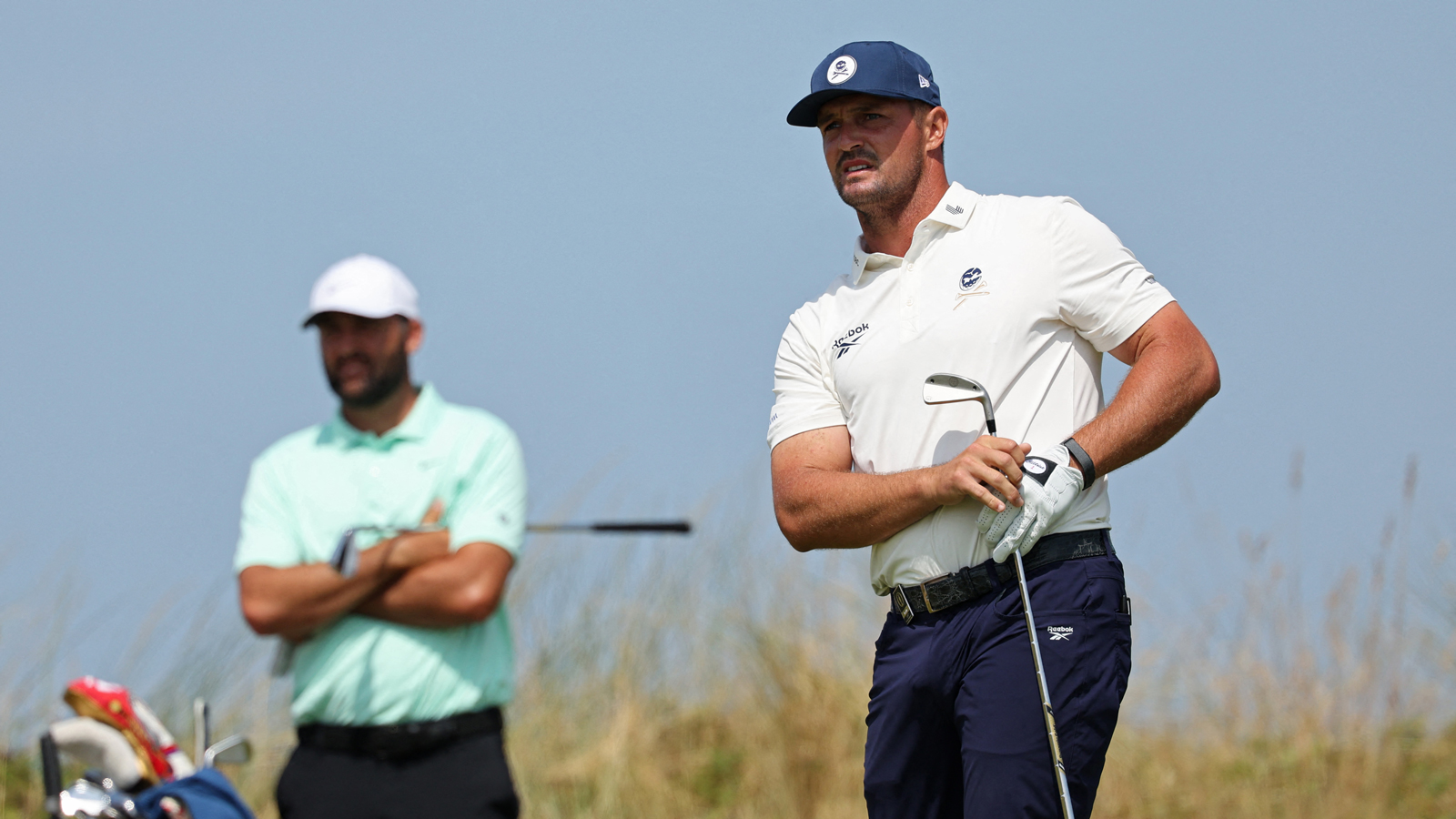 Bryson DeChambeau hits a tee shot and watches it flight