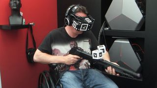 Kris Roberts trying Starbreeze VR HMD at E3.