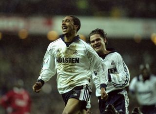 Chris Armstrong celebrates a goal against Liverpool with Tottenham team-mate Luke Young in January 2000.