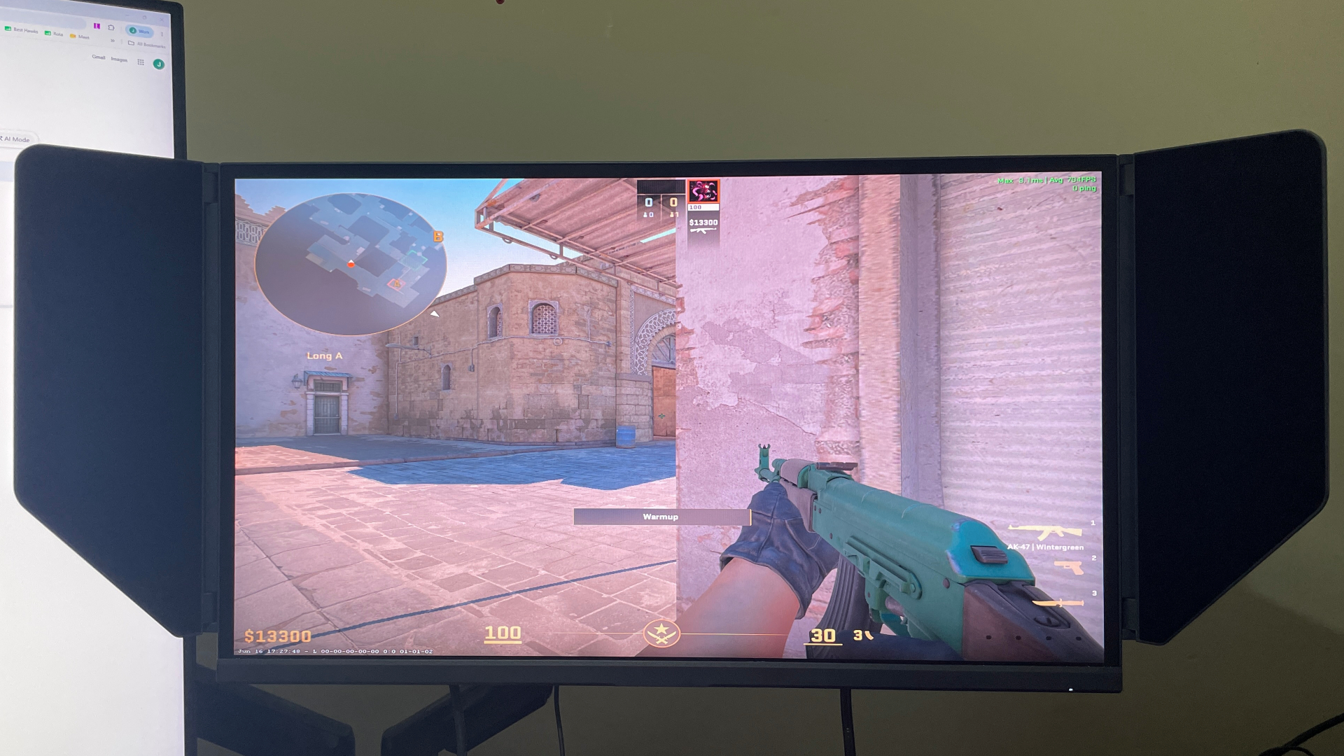 A KTC 25M1 gaming monitor with Counter-Strike 2 on-screen.