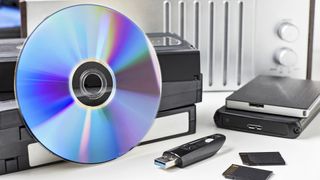 best vhs to dvd converters: image shows DVD discs and VHS tapes