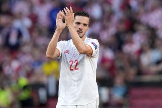 Spain’s Pablo Sarabia applauds as he leaves the pitch