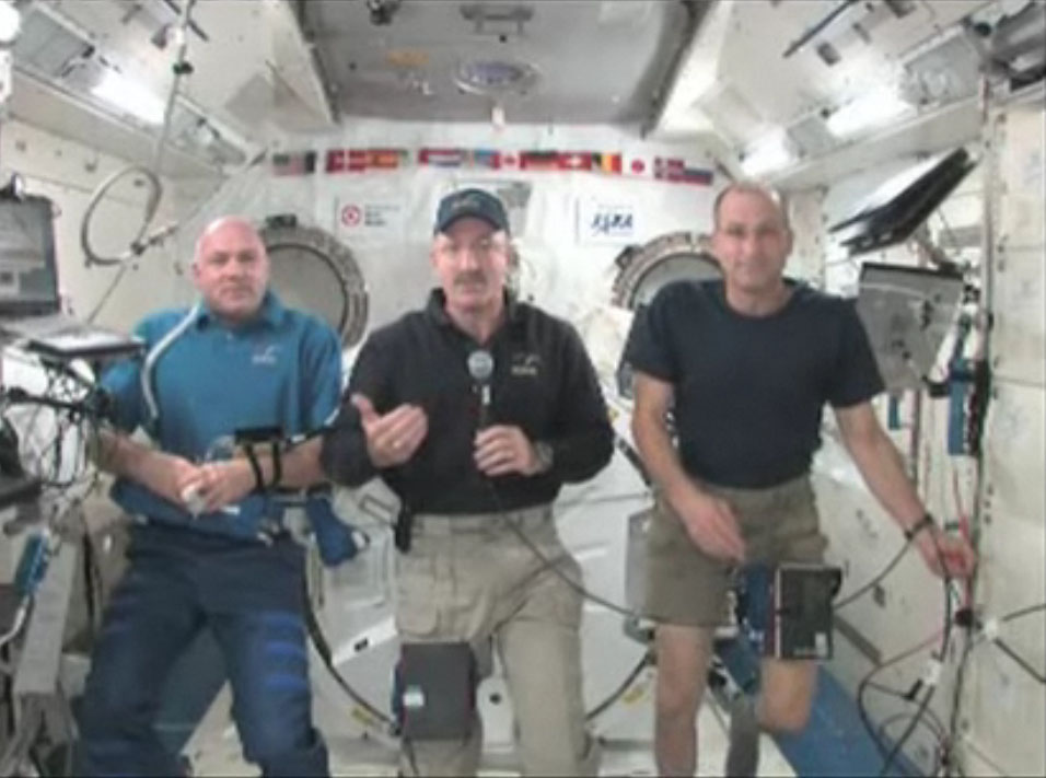 Space station commander Dan Burbank (center) and fellow Expedition 30 crewmates Don Pettit (right) and Andre Kuipers answer SPACE.com reader questions in a Jan. 4, 2012 interview with assistant managing editor Clara Moskowitz.