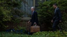 John Bolton leaves his home after being indicted