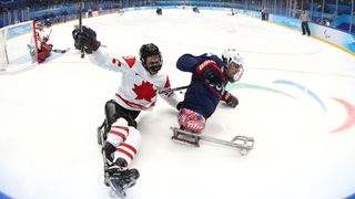 Liam Hickey #23 of Team Canada competes with Brody Roybal #4 of Team United States in the second period during the Para Ice Hockey Gold Medal game on day nine of the Beijing 2022 Winter Paralympics at the National Indoor Stadium on March 13, 2022 in Beijing, China.