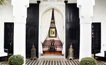 Black and white building design leading to seating area