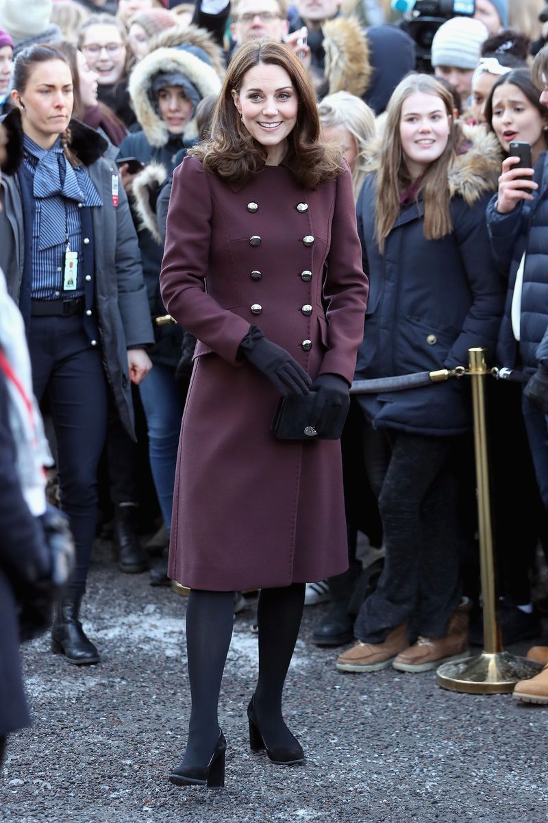 Clothing, Fashion, Event, Standing, Outerwear, Street fashion, Coat, Footwear, Uniform, Dress,