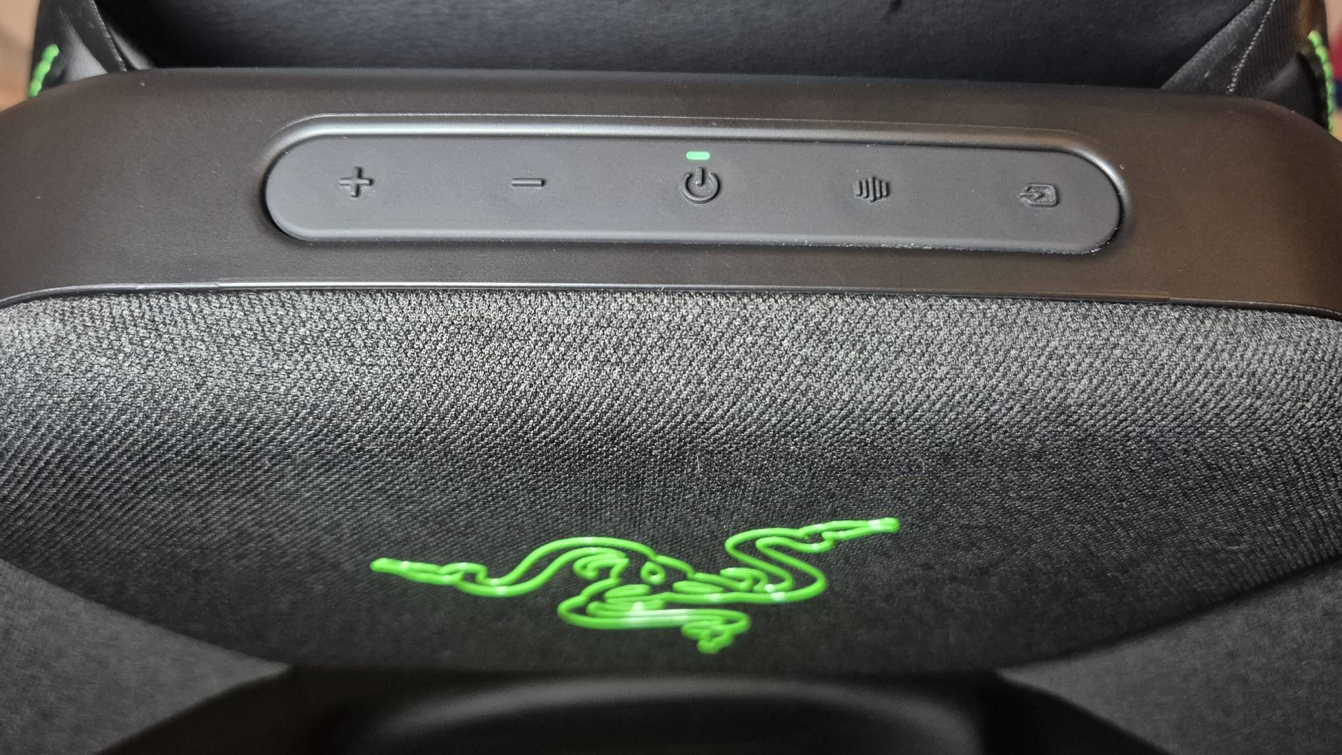 Photo by Rosalie Newcombe of the Razer Clio wireless speaker cushion, with a pink room in the background.