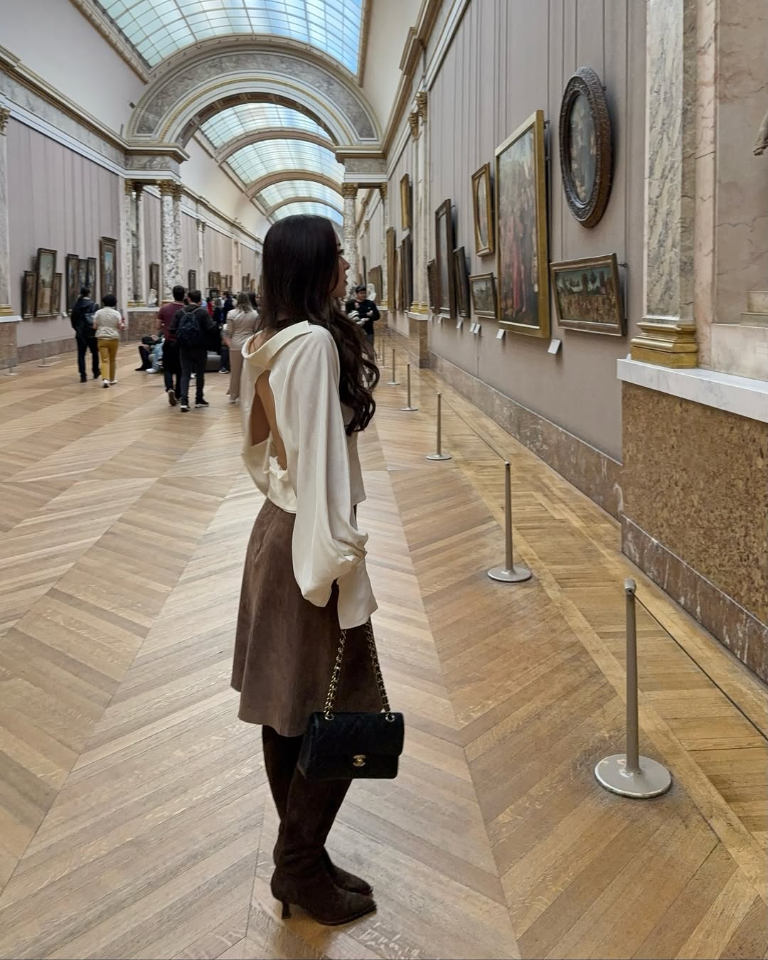 woman wearing knee high brown suede boot trend