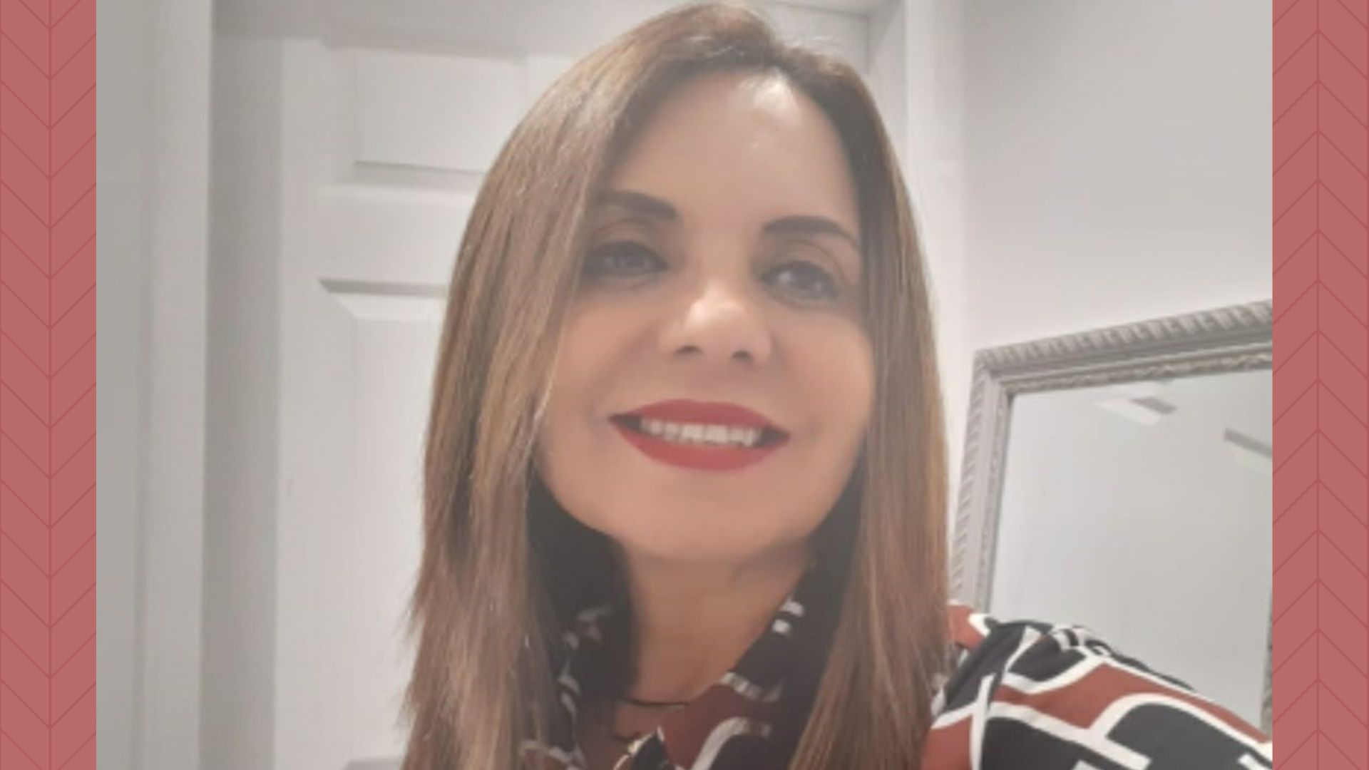 A close-up of Venezuelan Doctor Niloha Rangel, smiling and dressed smartly and beautifully
