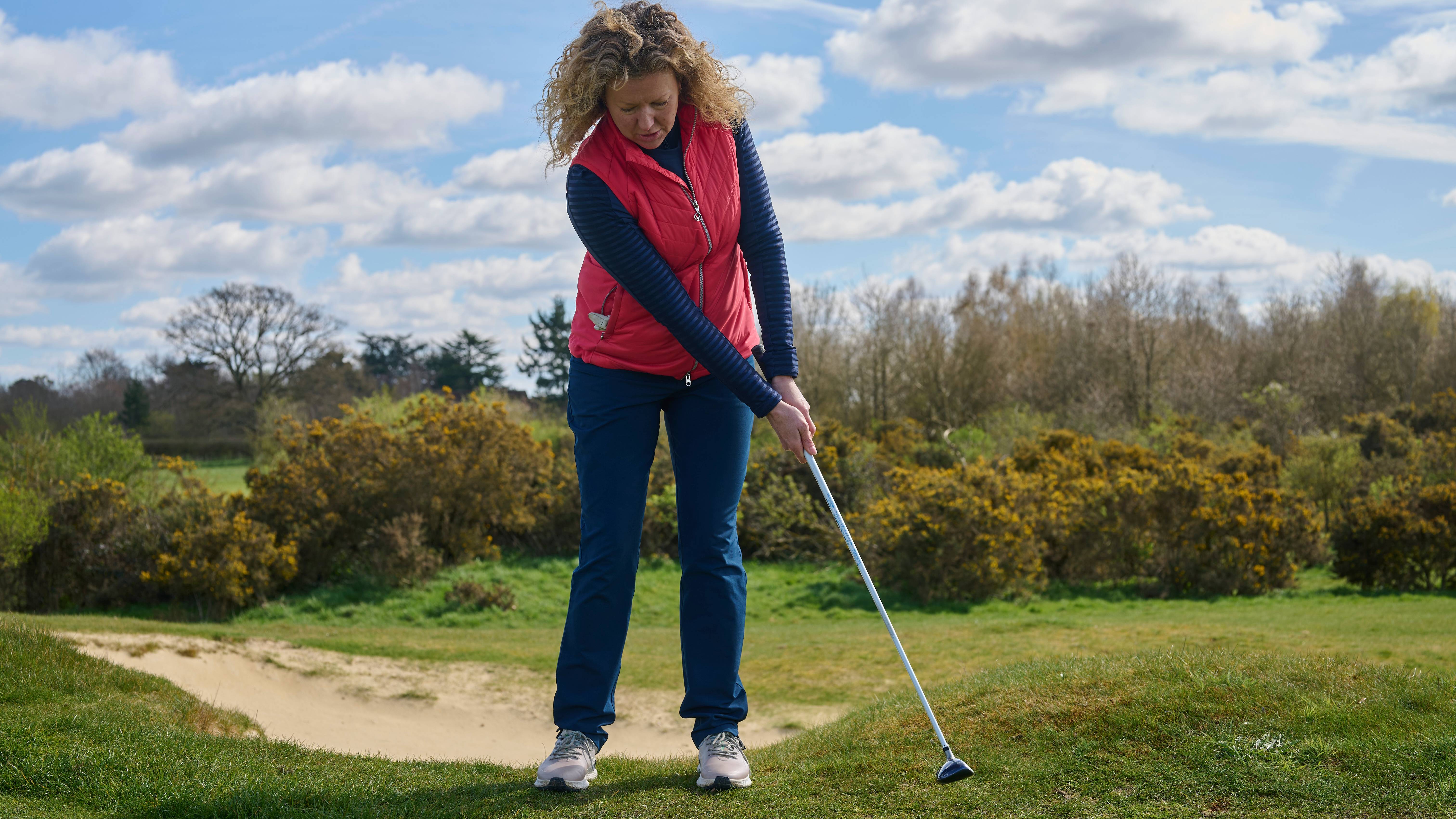 Katie Dawkins using a hybrid around the green