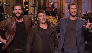 Saturday Night Live the Hemsworth brothers smiling on stage