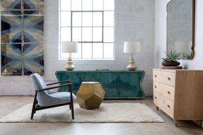 Living room with sofa and sideboard by Julian Chichester