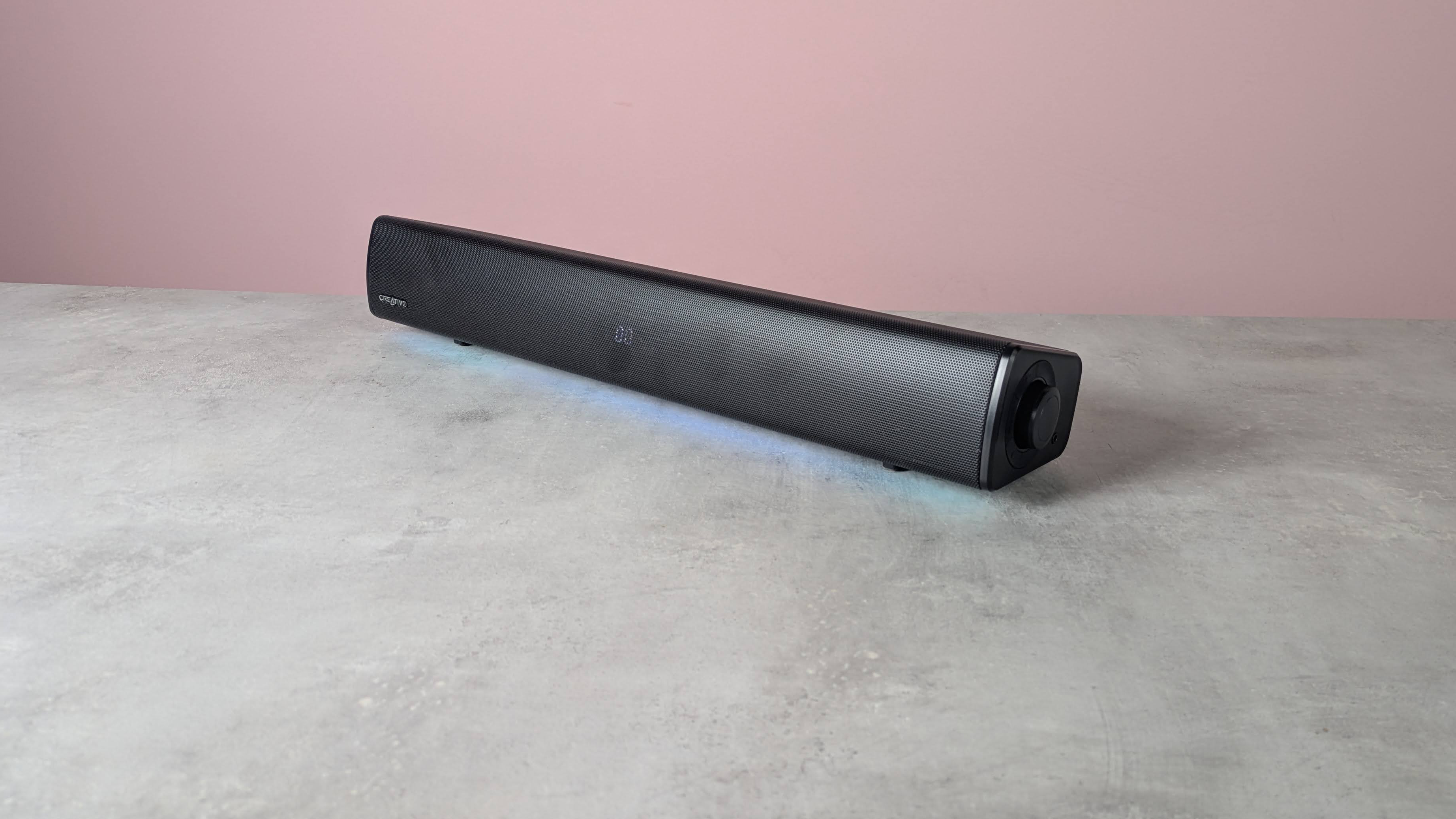 Creative Sound Blaster GS5 on a desk with pink wall in background