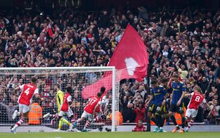 Bukayo Saka celebrates scoring a penalty against Manchester United