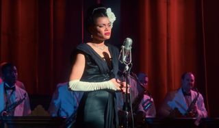 The United States vs Billie Holiday Andra Day stands at the mic on stage