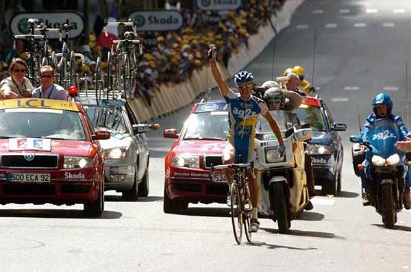 Sylvain Calzati (AG2R) crosses the line with a photo of his family