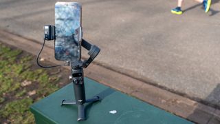 Osmo Mobile 7P resting on tripod