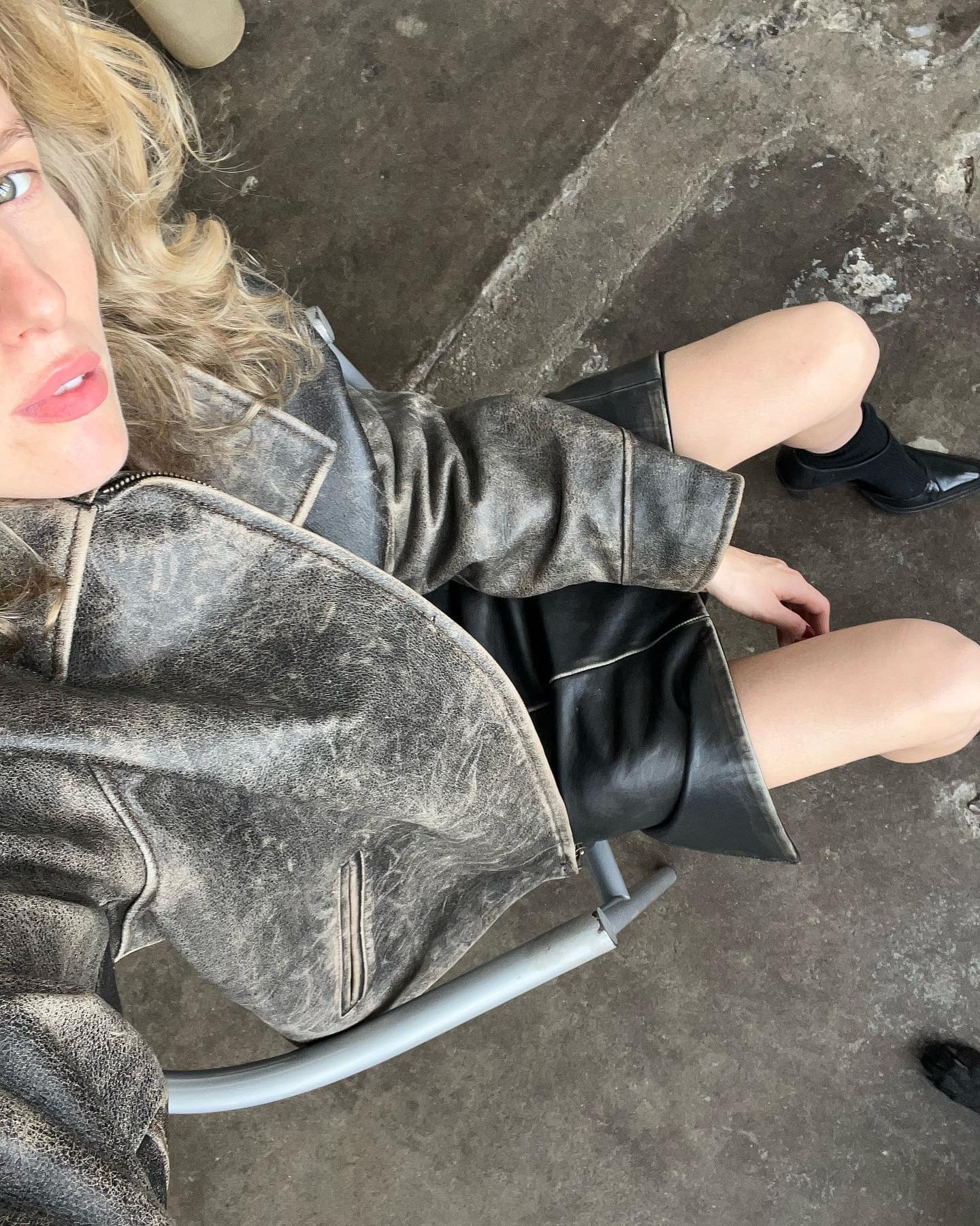 @ellymcgaw wearing a distressed leather jacket with a matching pencil skirt.