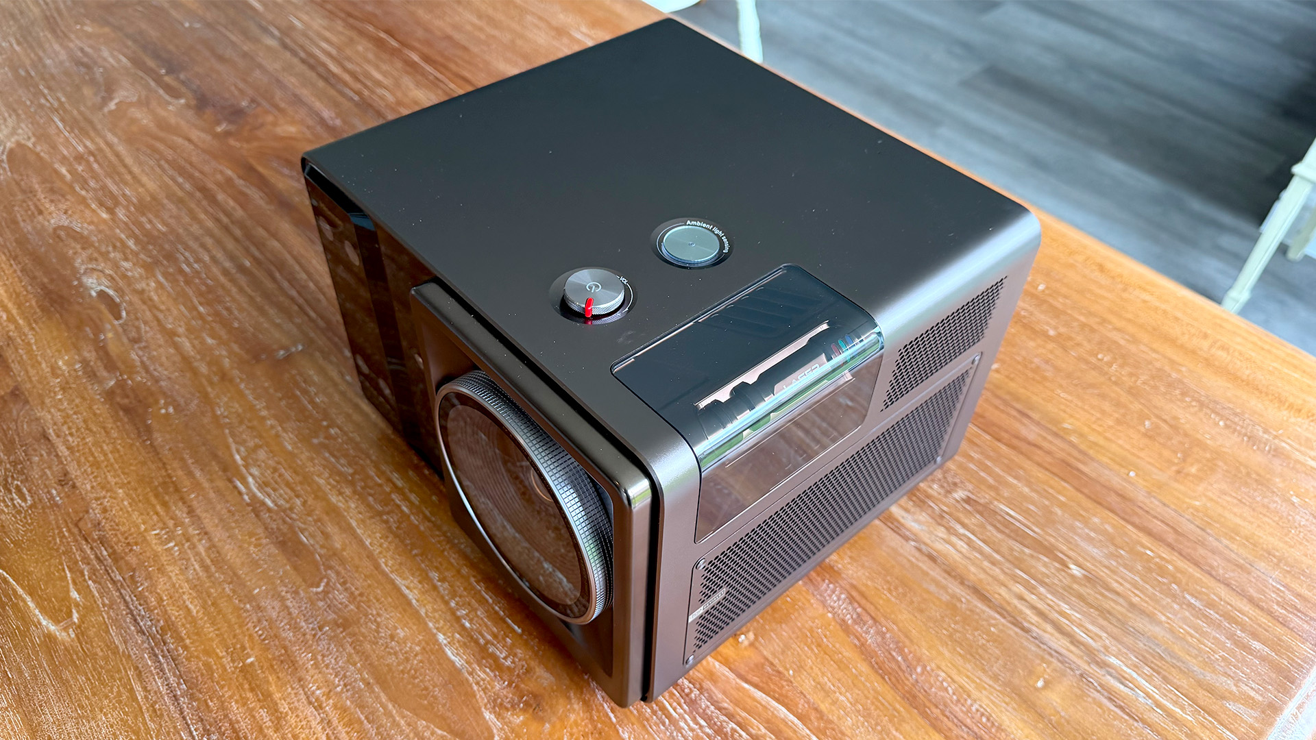 Hisense XR10 home cinema projector on wooden table