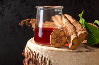 Ayahuasca brew sits on a table in this photograph.