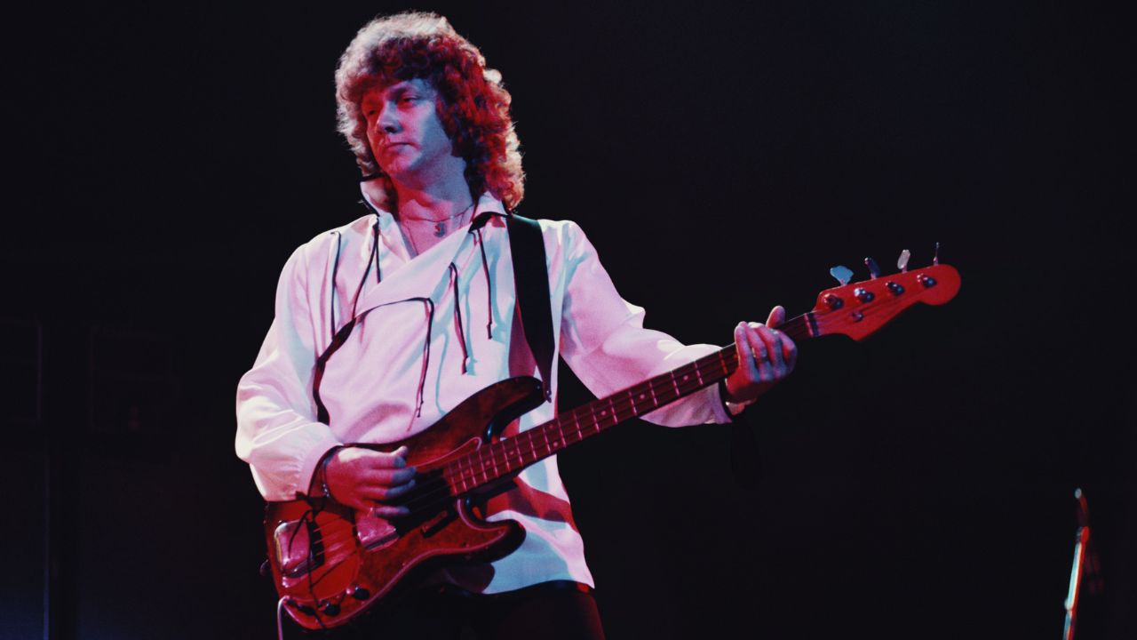 English musician and bass guitarist with The Moody Blues, John Lodge pictured live on stage performing the album Blue Jays in 1975