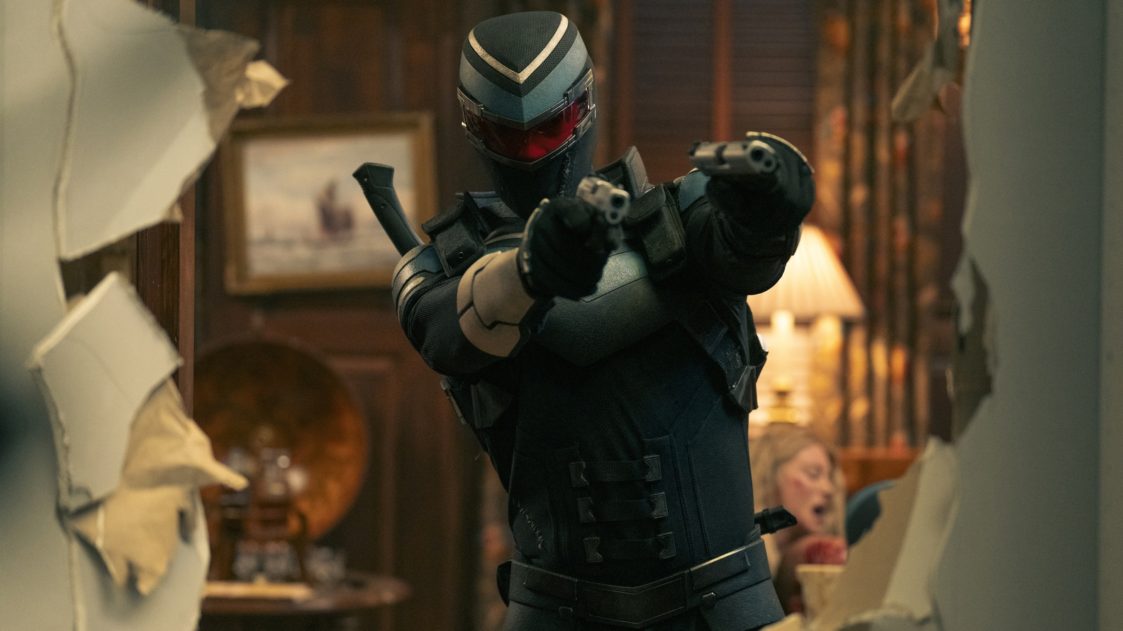 Adrian Chase/Vigilante with his handguns raised in Peacemaker season 2 episode 7