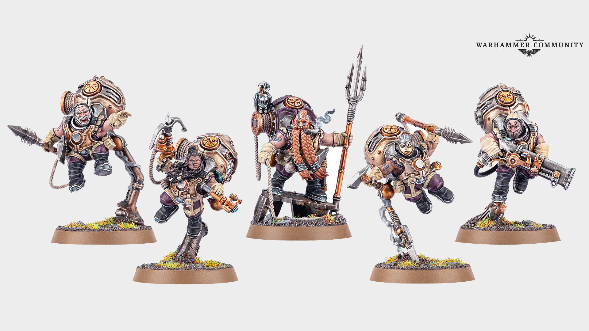 A selection of Warhammer Kharadron Overlords models lined up against a plain background, with a 'Warhammer Community' logo in the top right-hand corner of the frame