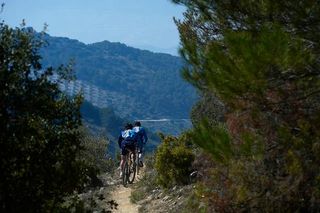 Two racers in the Andalucia Bike Race in Spain