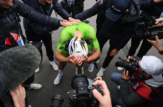 Reality hits Tadej Pogačar after winning the Road World Championships road race and completing cycling's Triple Crown.