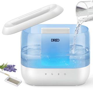 Dreo Humidifier with lid off and water being poured in from glass against white background.