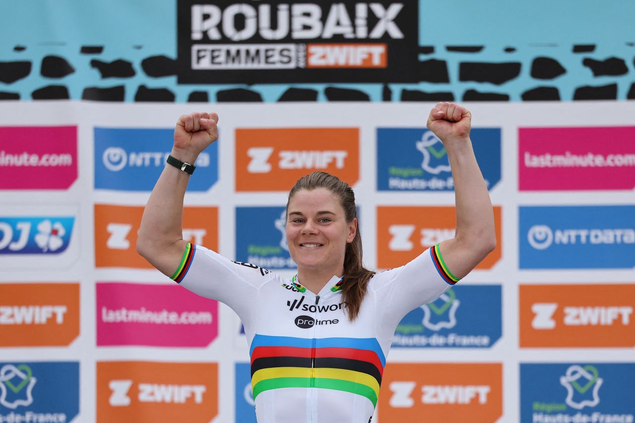 Team SD Worx - Protime's Belgian rider Lotte Kopecky celebrates on the podium after winning the fourth edition of the women's Paris-Roubaix one-day classic cycling race, 148,5km between Denain and Roubaix, on April 6, 2024. (Photo by Francois LO PRESTI / AFP)