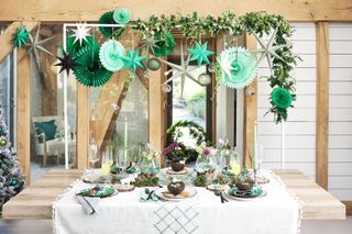 paper decorations on Christmas tablescape by Wayfair
