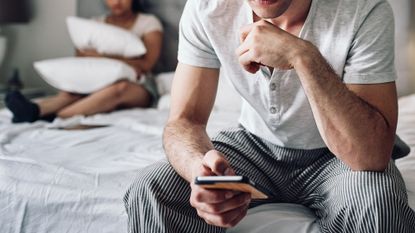 Man texting while ignoring his partner