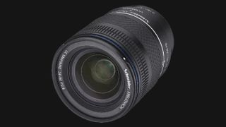 A close-up of a Samyang 24-60mm f/2.8 camera lens, featuring a textured grip and clear glass front, set against a dark background