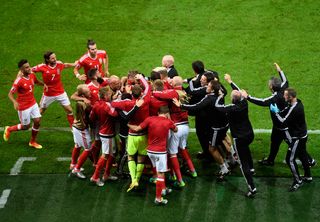 Wales players and staff celebrate Hal Robson-Kanu's goal against Belgium at Euro 2016.